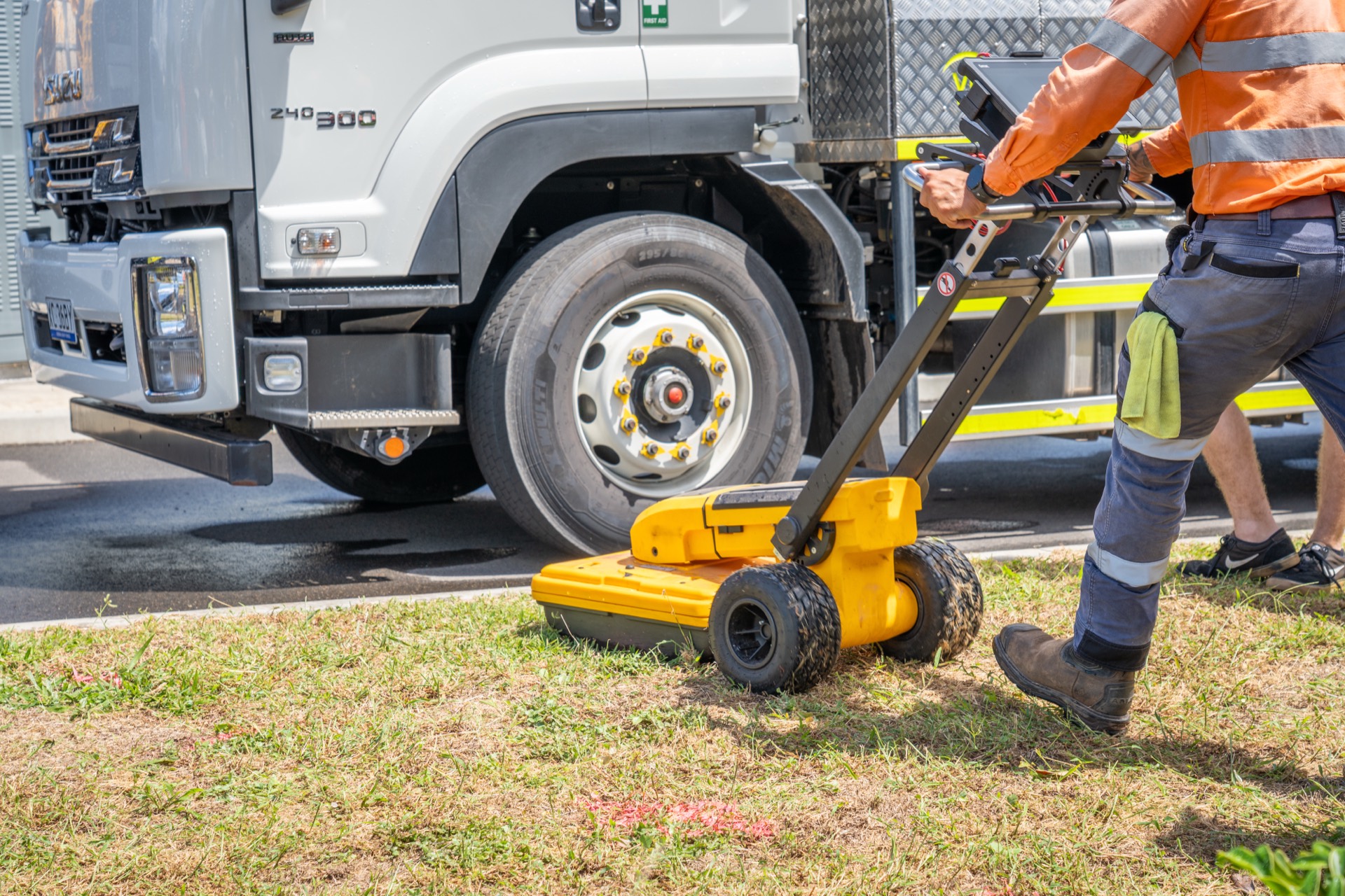 Ground-penetrating radar cart beside a GeoRadar vacuum truck